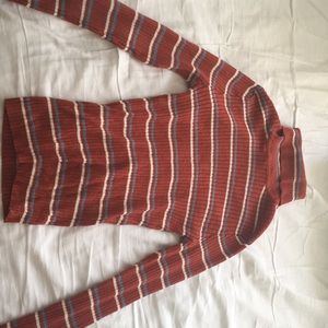 Turtle neck, striped sweater.